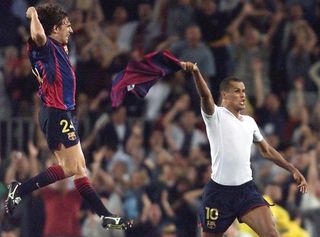 Rivaldo (right) and Carles Puyol celebrate after the Brazilian's overhead kick secures a 4-3 win over Valencia at Camp Nou in June 2001.