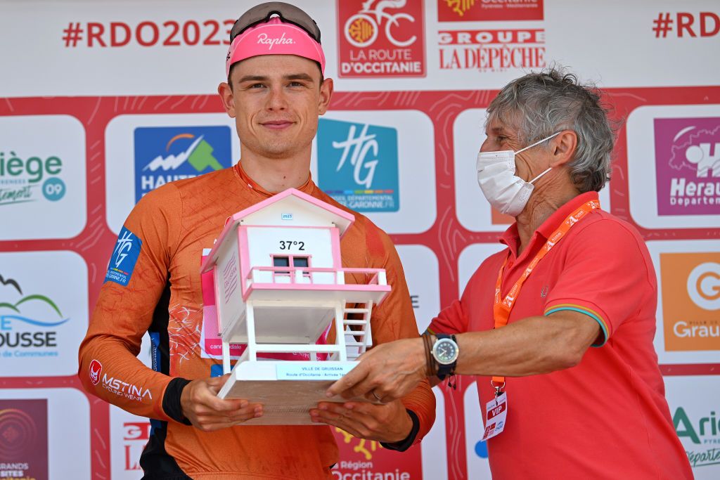 GRUISSAN FRANCE JUNE 15 Marijn van den Berg of The Netherlands and Team EF EducationEasyPost celebrates at podium as Red Leader Jersey winner during the 47th La Route DOccitanieLa Depeche Du Midi 2023 Stage 1 a 1843km stage from Narbonne to Gruissan on June 15 2023 in Gruissan France Photo by Luc ClaessenGetty Images