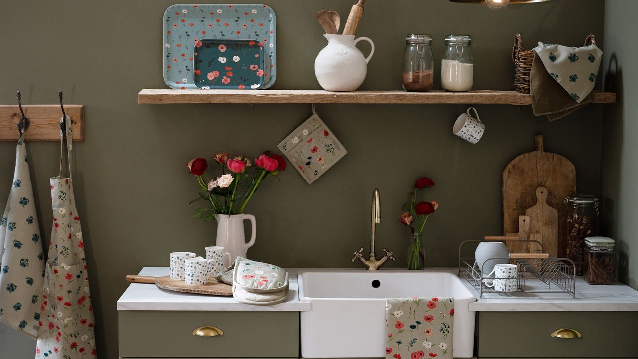 dark green kitchen with butlers sink