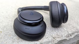 Anker Soundcore Space Q45 headphones placed on stone paving