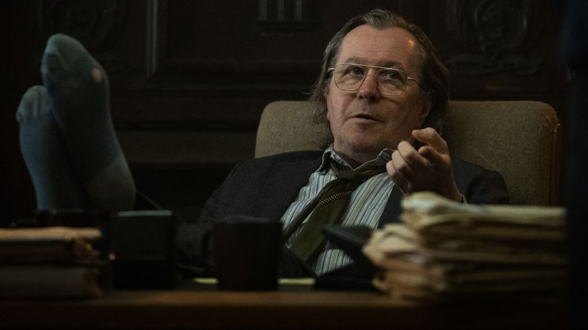 Gary Oldman leans back in his chair with his feet on the desk in Slow Horses.