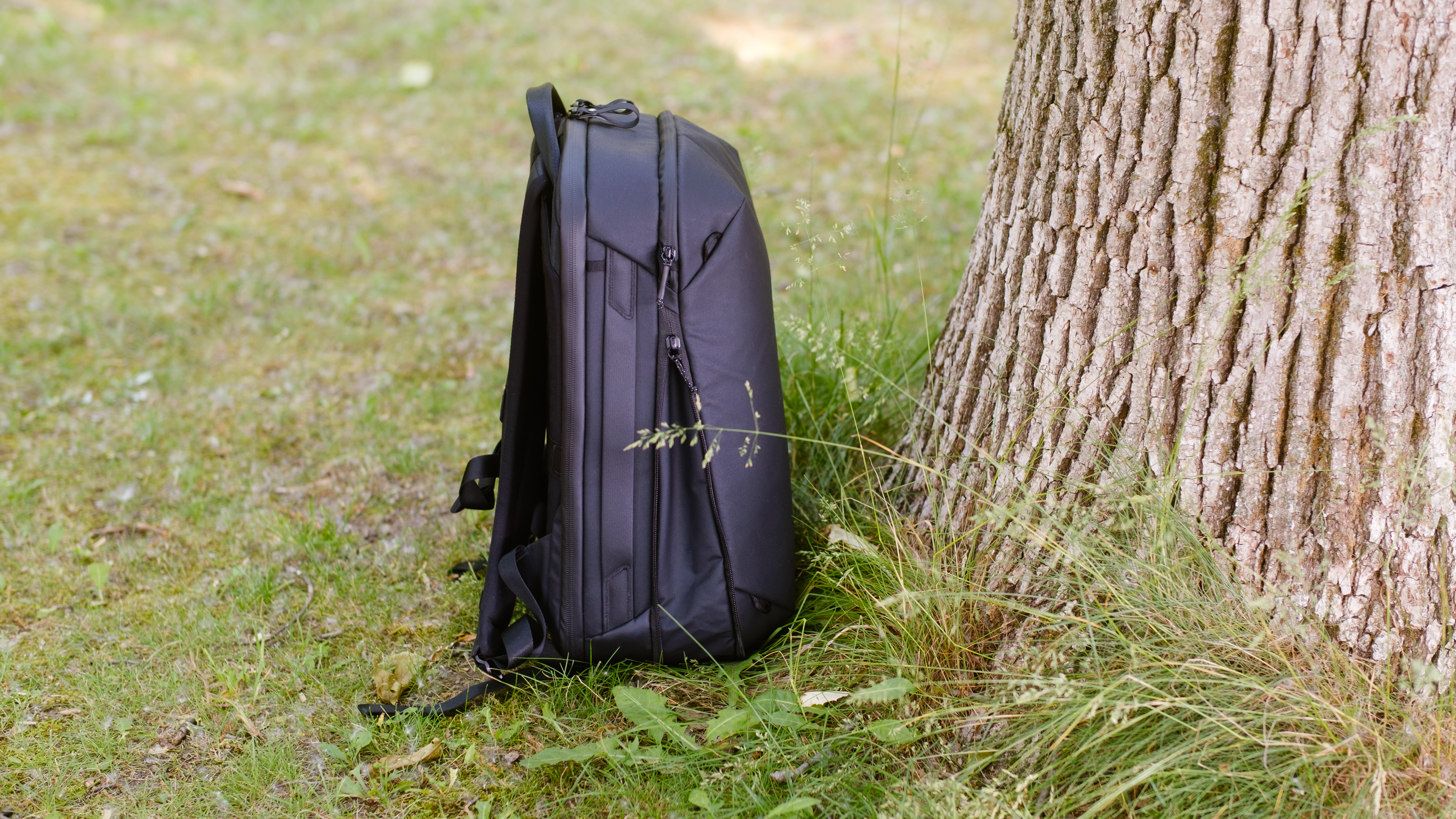 The Peak Design Travel Backpack 20L in use by a photographer