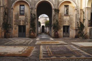 Moroccan rugs by Beni Rugs photographed in a courtyard