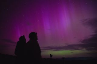 Northern lights (Aurora Borealis), also known as aurora, colorful lights shift, illuminate the sky in Debrad, Slovakia, May 11, 2024.