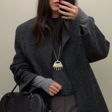 Woman in a gray outfit 