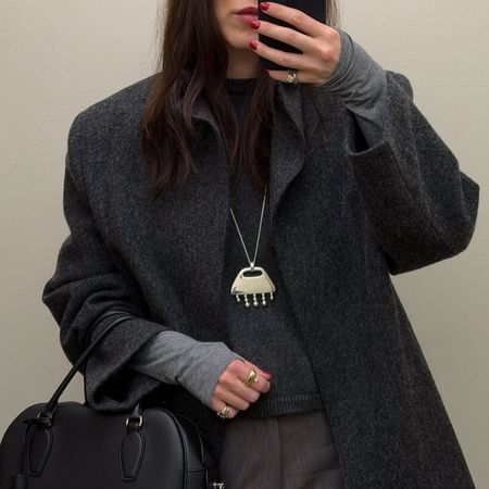 Woman in a gray outfit 