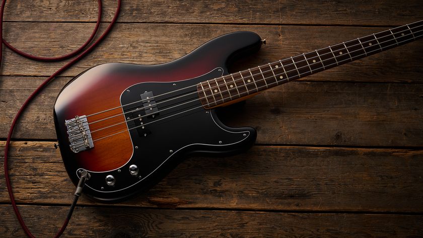 Fender American Professional Classic Precision Bass in 3-Color Sunburst shot on wood floor boards
