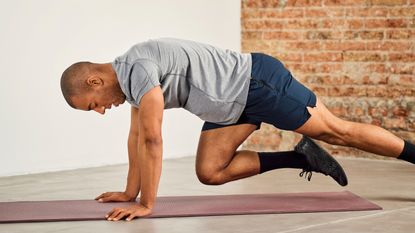 Man performing mountain climber core exercises