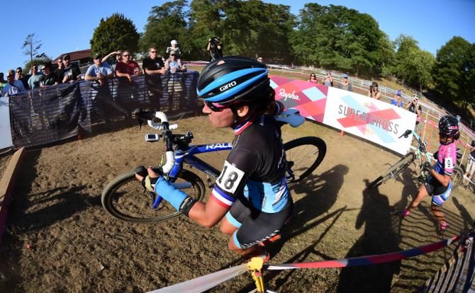 Caroline Mani (Raleigh Clement) racing in third position on lap three