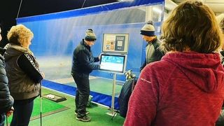 Golfers using simulator technology