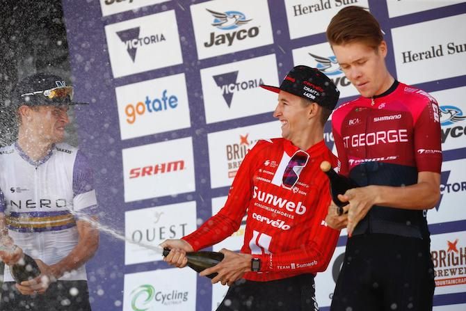 Second-placed Jay Vine (Nero Continental) receives a champagne shower from stage 4 winner Jai Hindley (Sunweb) as second-placed Sebastian Berwick (St George Continental) plays catch up