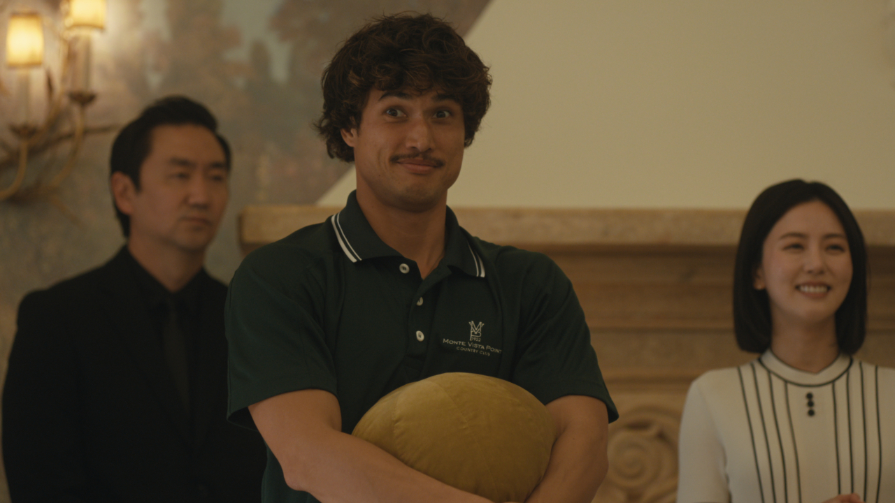 Austin (Charles Melton) looks happy, while Eunice (Seoyeon Jang) smiles on Beef.