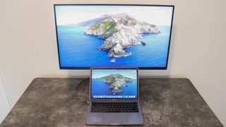 A MacBook Pro connected via USB-C to a Samsung M7 Smart Monitor