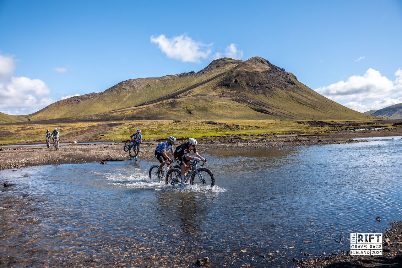 Simen Nordahl Svendsen (PAS Racing) leads elite men on river crossing on his way to second title at the Rift Gravel
