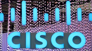 The Cisco logo hanging against fairy lights
