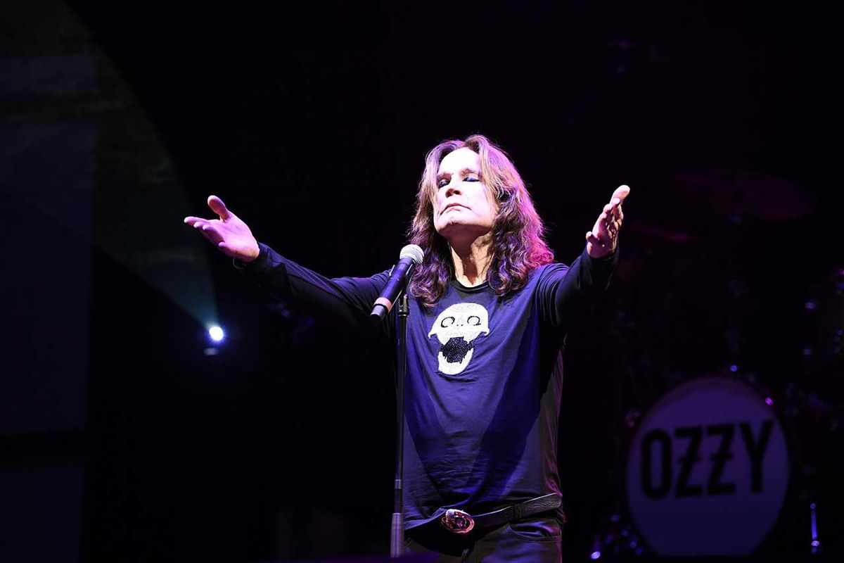 Ozzy Osbourne with arms outstretched