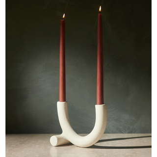 white dual candle holder in a curved slim abstract shape