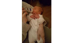 Baby being bottle fed