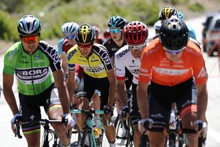 George Bennett is surrounded by heavy hitters in the yellow jersey