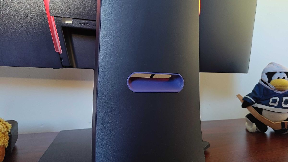 Close up of LG UltraGear 32GS95UE-B cable management hole on stand