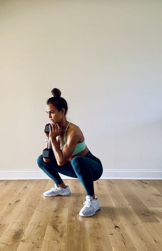 Trainer Melissa Kendter demonstrating a goblet squat