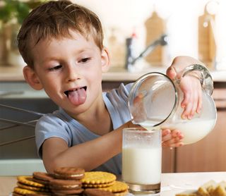 boy with milk and coookies