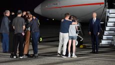 Former Russian prisoners reunite with their families while President Joe Biden looks on