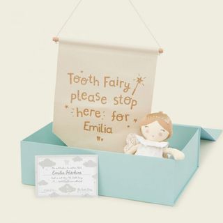 Personalized gifts for babies illustrated by blue box with goodies in