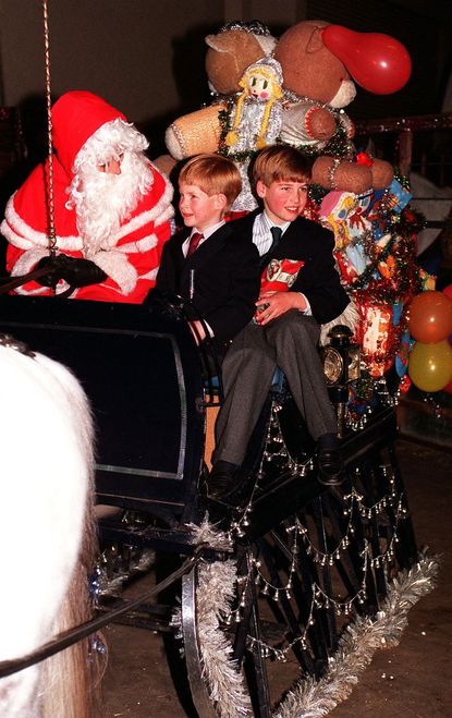 Royal kids help decorate the tree. 