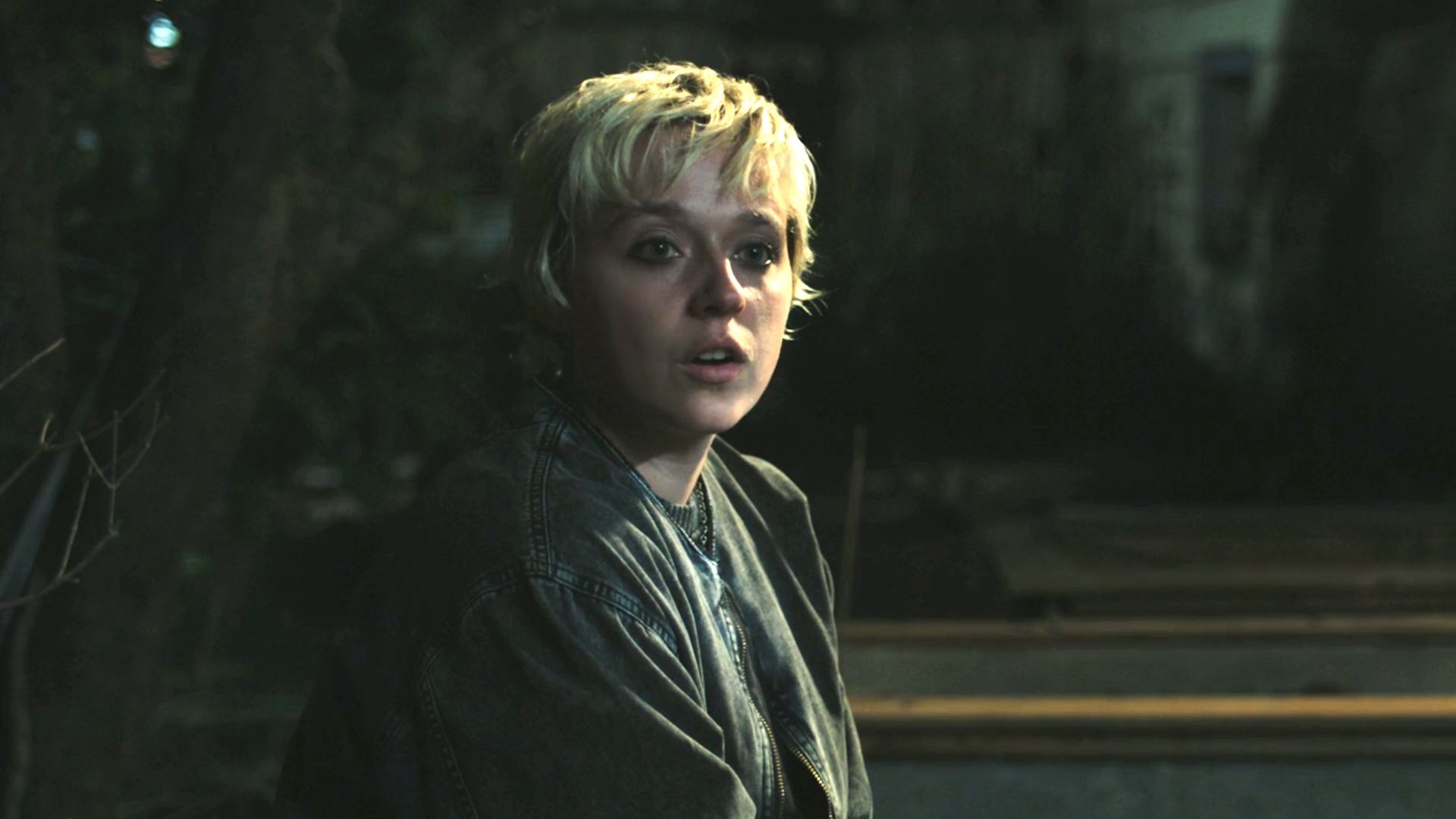 Emaline talking to Carrie in her backyard at night.