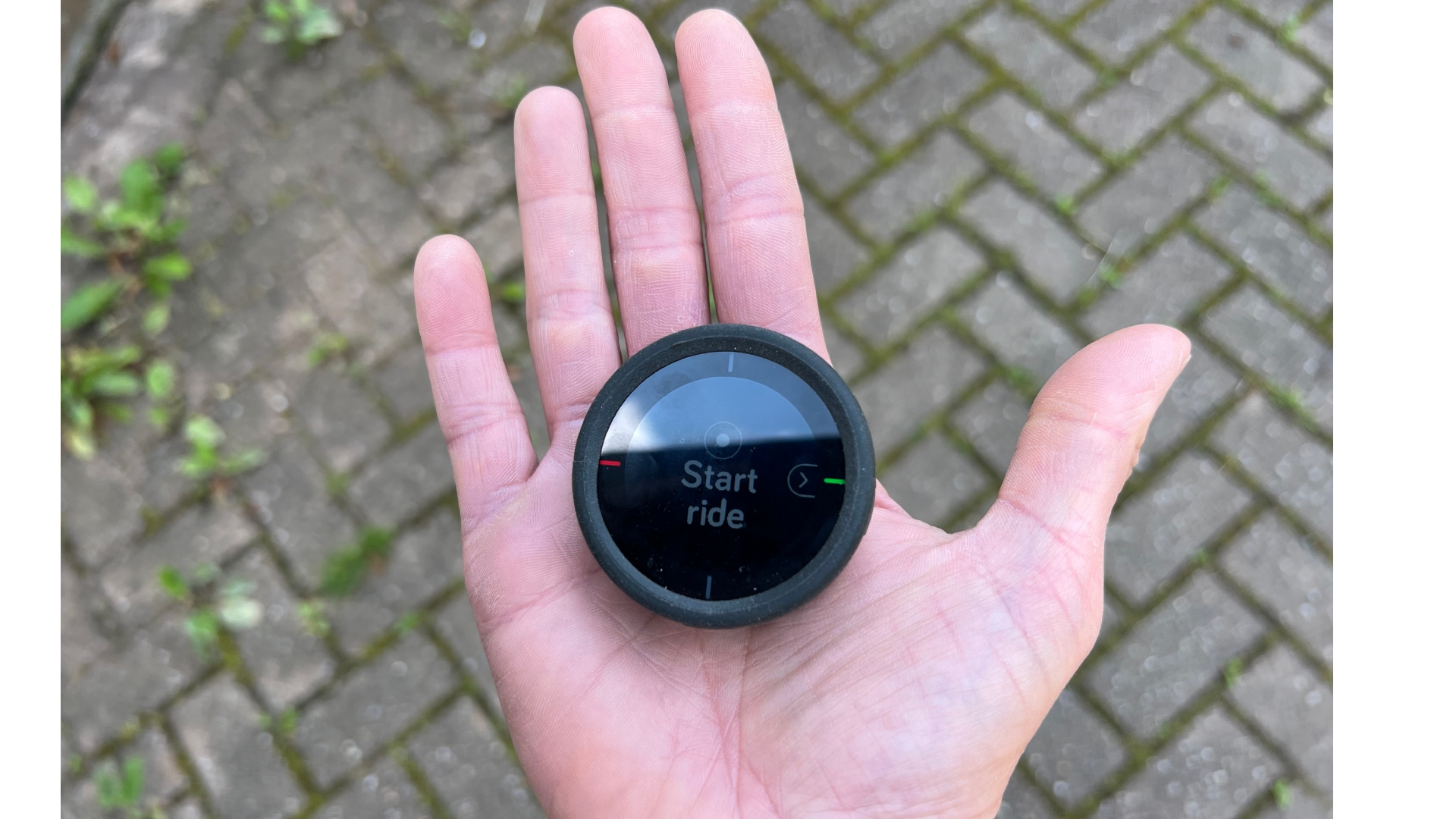 The Beeline Velo 2 fitting into the palm of a women's hand