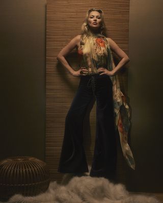 Kate moss wearing a chiffon floral top with wide leg pants