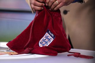 A velvet bag containing balls for an FA Cup draw