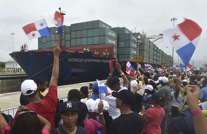 A Chinese container ship moves through the expanded Panama Canal