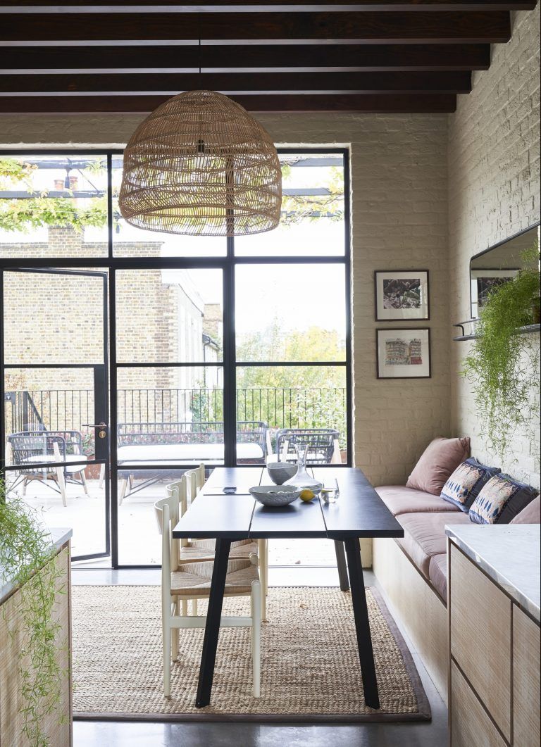 Dining area with built in storage bench and crittall doors