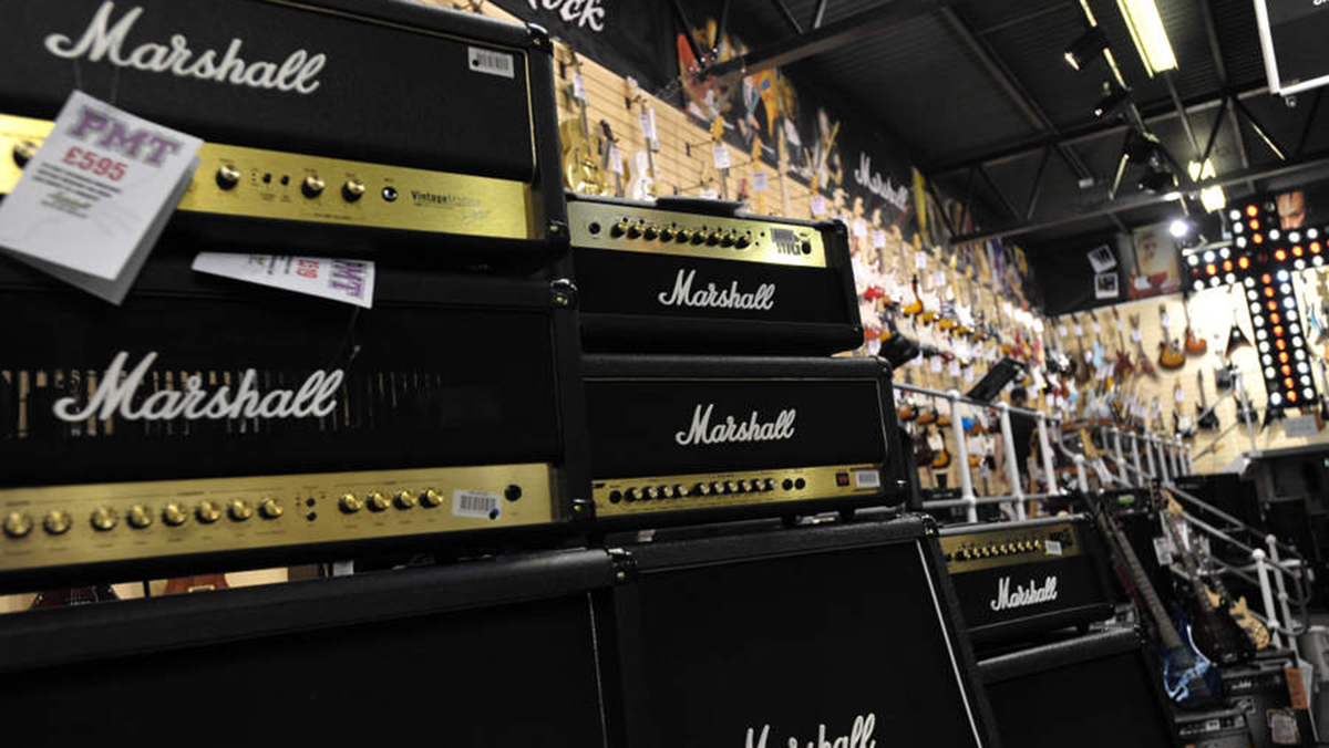 A group of Marshall amps with a wall of guitars behind, during the ESP guitars beach party at the PMT music shop on June 05, 2010