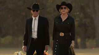 Everett and Beulah walk through a graveyard in funeral attire