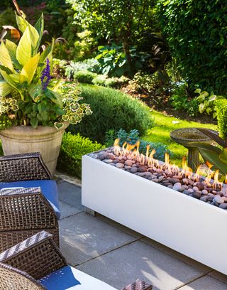 Long gas fuel fire pit on a patio