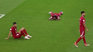 Qatar players show dejection after the third goal of Senegal during the FIFA World Cup Qatar 2022 Group A match between Qatar and Senegal at Al Thumama Stadium on November 25, 2022 in Doha, Qatar.