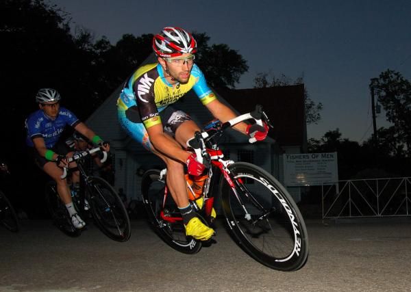 Team Mountain Khakis rider leading through the first corner