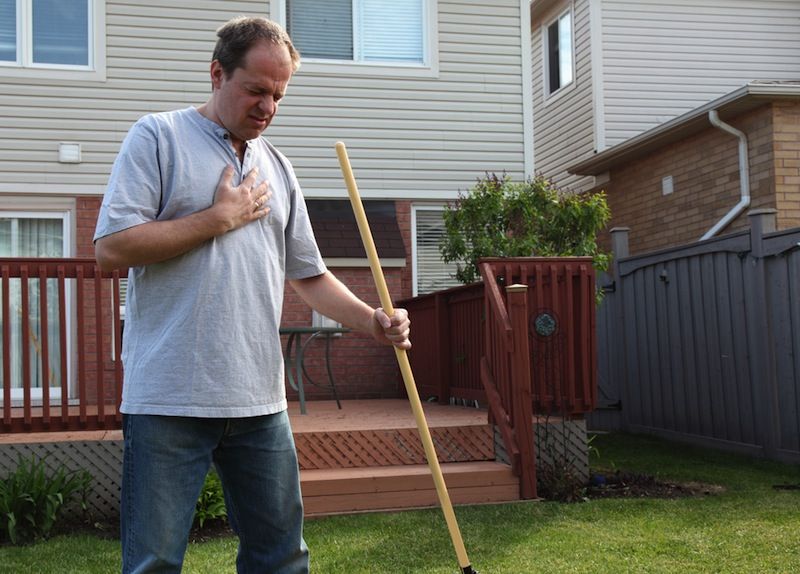 A man doing yardwork develops chest pains.