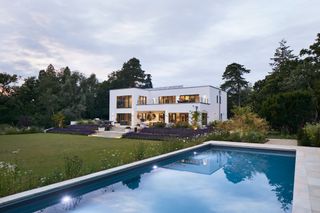 large white self build with modern swimming pool