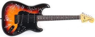 A Fender Stratocaster signed by all five Generation Axe guitarists
