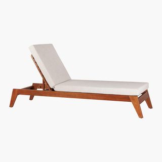 Wooden lounge chair with natural cushion