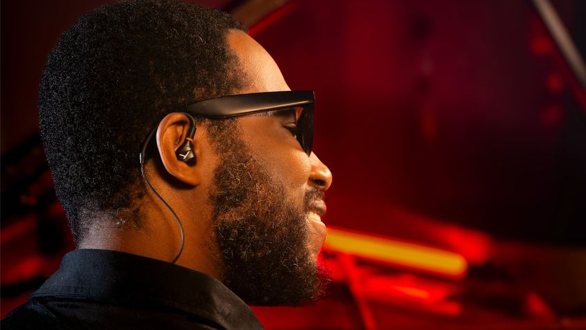 Cory Henry wearing Beyerdynamic&#039;s new pro-specific IEMs, sitting at a piano