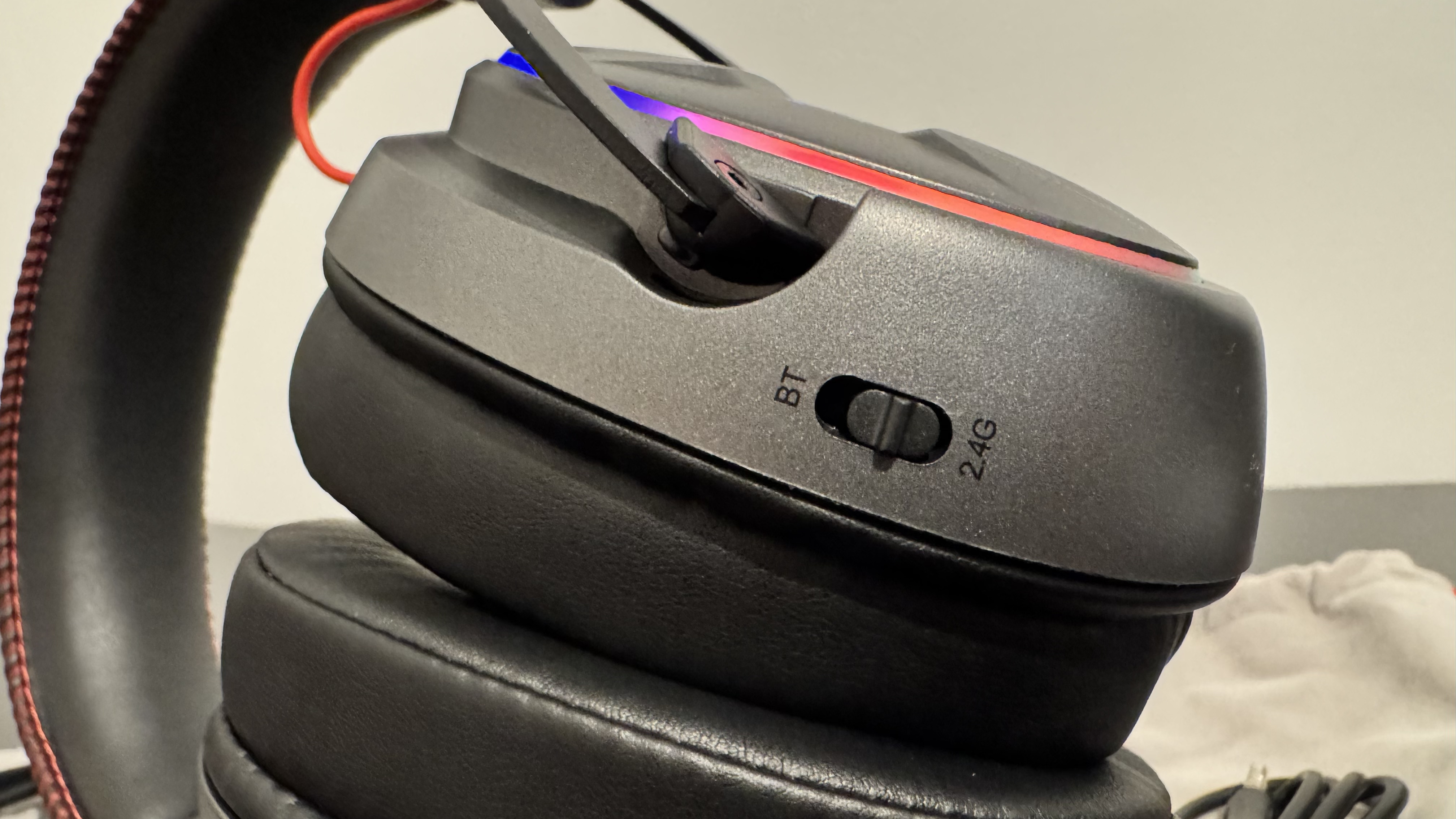 The OXS Storm G2 gaming headset on a black table