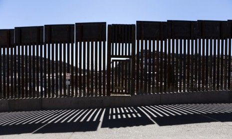 The U.S.-Mexico border fence in Nogales, Ariz.: For the first time in decades, more illegal Mexican immigrants are leaving the U.S. than entering.