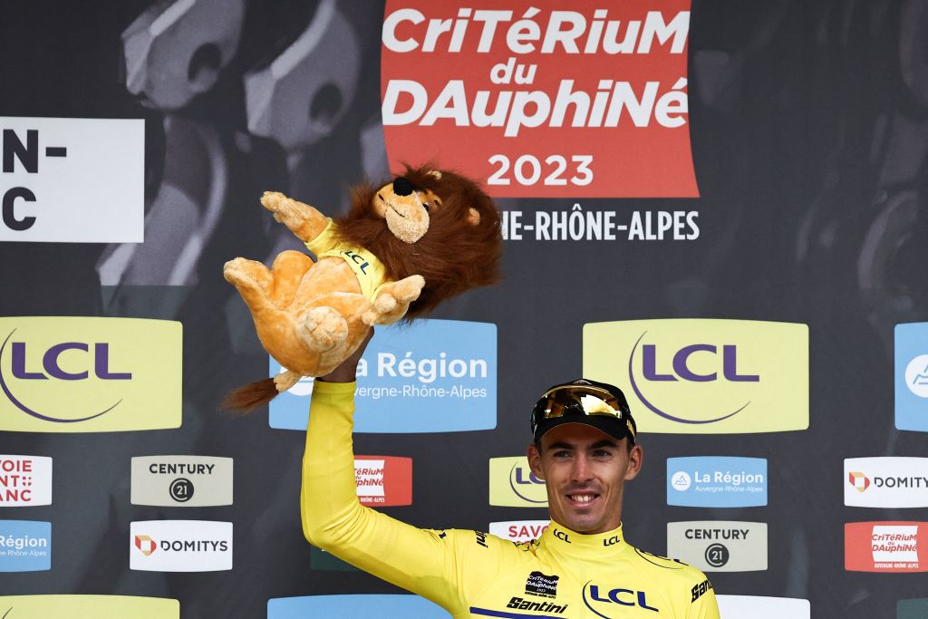 Christophe Laporte (jumbo-Visma) celebrates on the podium with the yellow jersey of overall leader after winning the first stage of the 75th edition of the Criterium du Dauphine