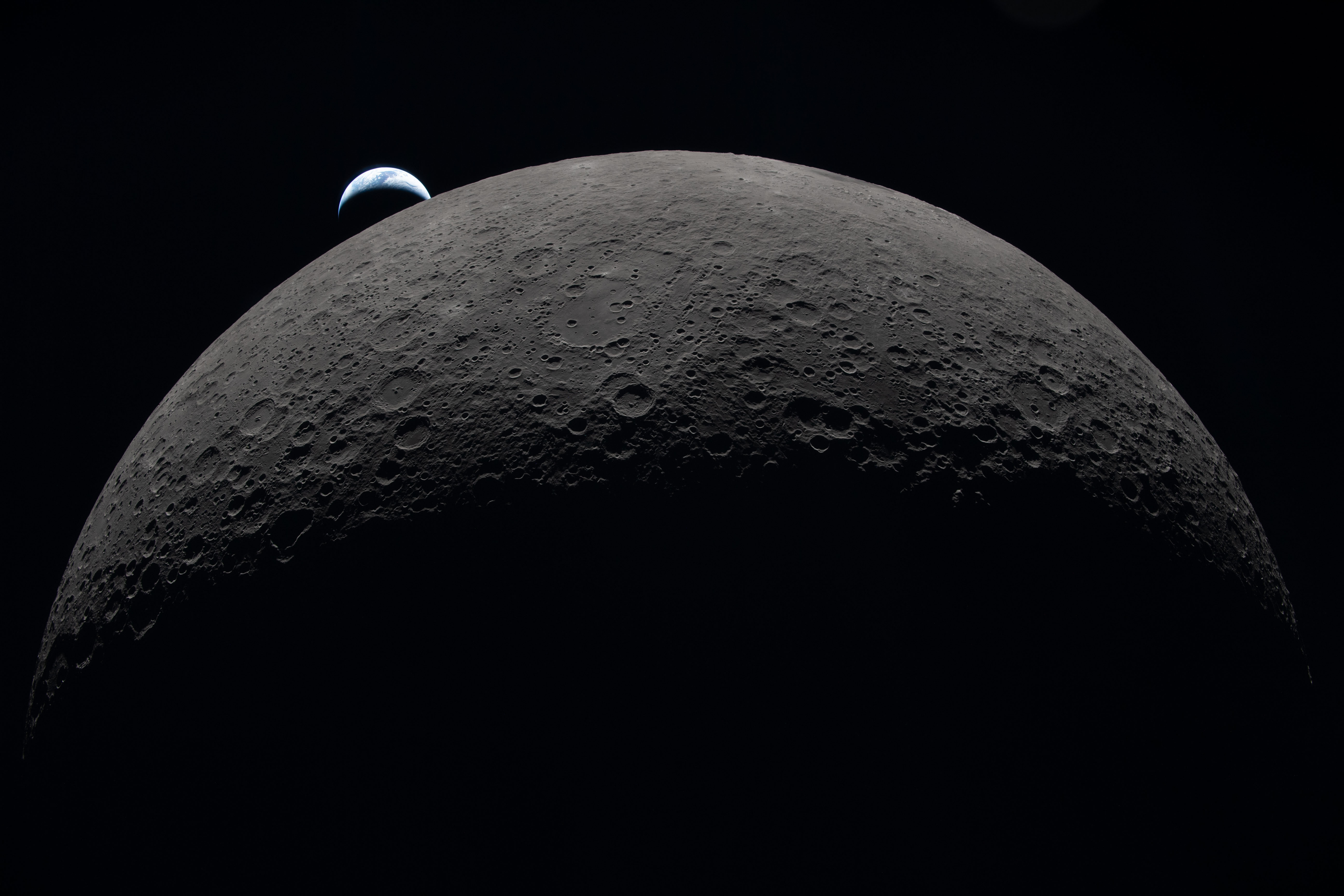 A photograph of the moon and Earth taken from Artemis II