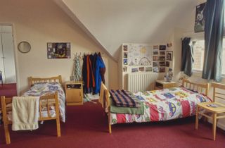 Interior view of a dormitory at Ludgrove School, an independent preparatory boarding school in Wokingham, Berkshire, England, 18th November 1989. Notable Old Ludgrovians include Prince William and his brother, Prince Harry. (